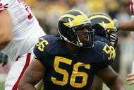 ANN ARBOR, MI - SEPTEMBER 23:  LaMarr Woodley #56 of the Michigan Wolverines stands over John Stocco #7 of the Wisconsin Badgers after a sack on September 23, 2006 at Michigan Stadium in Ann Arbor, Michigan. Michigan defeated Wisconsin 27-13.  (Photo by Jonathan Daniel/Getty Images)