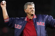 BOSTON - OCTOBER 23:  Boston Red Sox hall of famer Carl Yastrzemski throws out the first pitch before game one of the World Series between the St. Louis Cardinals and the Red Sox on October 23, 2004 at Fenway Park in Boston, Massachusetts. (Photo by Al Bello/Getty Images)