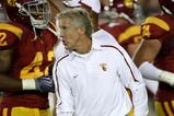 LOS ANGELES, CA - SEPTEMBER 26:  Head coach Pete Carroll of the USC Trojans works during warmups for the game with the Washington State Cougars on September 23, 2009 at the Los Angeles Coliseum in Los Angeles, California.  USC won 27-6.  (Photo by Stephen Dunn/Getty Images)