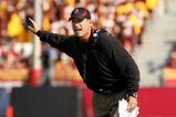 LOS ANGELES, CA - NOVEMBER 14:  Head coach Jim Harbaugh of the Stanford Cardinal signals during the game with the USC Trojans on November 14, 2009 at the Los Angeles Coliseum in Los Angeles, California.  Stanford won 55-21.  (Photo by Stephen Dunn/Getty Images)