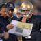 SOUTH BEND, IN - OCTOBER 17: Head coach Charlie Weis of the Notre Dame Fighting Irish gives a play to quarterback Jimmy Clausen #7 during a game against the USC Trojans at Notre Dame Stadium on October 17, 2009 in South Bend, Indiana. USC defeated Notre Dame 34-27. (Photo by Jonathan Daniel/Getty Images)