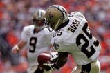DENVER - SEPTEMBER 21:  Running back Reggie Bush #25 of the New Orleans Saints receives a screen pass from quarterback Drew Brees against the Denver Broncos during NFL action at Invesco Field at Mile High on September 21, 2008 in Denver, Colorado. The Broncos defeated the Saints 34-32.  (Photo by Doug Pensinger/Getty Images)