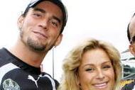 AUCKLAND, NEW ZEALAND - JUNE 11:  (L-R) WWE wrestlers CM Punk, Natalya and MVP pose for a photo with Warriors jerseys after a  Warriors NRL  training session at Mt Smart Stadium on June 11, 2008 in Auckland, New Zealand.  (Photo by Sandra Mu/Getty Images)