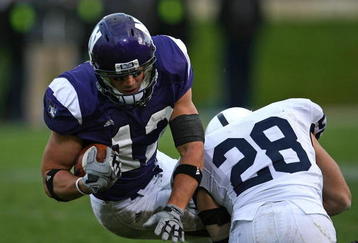 EVANSTON, IL - OCTOBER 31: Andrew Brewer #12 of the Northwestern Wildcats is tackled by Drew Astorino #28 of the Penn State Nittany Lions at Ryan Field on October 31, 2009 in Evanston, Illinois. Penn State defeated Northwestern 34-13. (Photo by Jonathan Daniel/Getty Images)