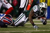 EAST RUTHERFORD, NJ - OCTOBER 18: Thomas Jones #20 of the New York Jets is tackled after a run by Jairus Byrd #31 of the Buffalo Bills during the game on October 18, 2009 at Giants Stadium in East Rutherford, New Jersey. The Bills defeated the Jets 16-13 in overtime. (Photo by Jared Wickerham/Getty Images)