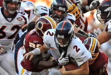 LANDOVER, MD - NOVEMBER 15:  Chris Simms #2 of the Denver Broncos is sacked during the game against the Washington Redskins at FedExField on November 15, 2009 in Landover, Maryland. The Redskins defeated the Broncos 27-17. (Photo by Larry French/Getty Images)
