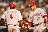PHOENIX - MAY 12:  Laynce Nix #17 of the Cincinnati Reds congratulates teammate Brandon Phillips #4 after he scored against the Arizona Diamondbacks during the fourth inning of the major league baseball game at Chase Field on May 12, 2009 in Phoenix, Arizona.  (Photo by Christian Petersen/Getty Images)