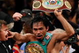 LAS VEGAS - NOVEMBER 14:  Manny Pacquiao celebrates his 12 round TKO victory against Miguel Cotto during their WBO welterweight title fight at the MGM Grand Garden Arena on November 14, 2009 in Las Vegas, Nevada.  (Photo by Ethan Miller/Getty Images)