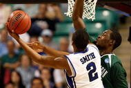 GREENSBORO, NC - MARCH 19:  Nolan Smith #2 of the Duke Blue Devils lays in a basket against Kyrie Sutton #33 of the Binghamton Bearcats during the first round of the NCAA Division I Men's Basketball Tournament at the Greensboro Coliseum on March 19, 2009 in Greensboro, North Carolina.  (Photo by Streeter Lecka/Getty Images)