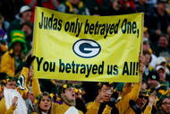 GREEN BAY, WI - NOVEMBER 01:  Fans hold a sign referring to quarterback Brett Favre #4 of the Minnesota Vikings during the game against the Green Bay Packers at Lambeau Field on November 1, 2009 in Green Bay, Wisconsin. (Photo by Scott Boehm/Getty Images)