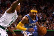 BOSTON - NOVEMBER 7:   Allen Iverson #3 of the Denver Nuggets drives past Rajon Rondo #9 of the Boston Celtics during the game on November 7, 2007 at the TD Banknorth Garden in Boston, Massachusetts.  The Celtics won 119-93.  NOTE TO USER: User expressly acknowledges and agrees that, by downloading and or using this Photograph, user is consenting to the terms and conditions of the Getty Images License Agreement.  (Photo by Elsa/Getty Images)