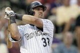 DENVER - JULY 17:  Right fielder Larry Walker #33 of the Colorado Rockies watches the flight of the ball as he follows through on a swing during the game against the San Francisco Giants at Coors Field on July 17, 2004 in Denver, Colorado.  The Giants won 4-0. (Photo by Brian Bahr/Getty Images)