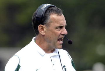 ORLANDO, FL - JANUARY 1: Coach Mark Dantonio of the Michigan State Spartans directs play against the Georgia Bulldogs at the 2009 Capital One Bowl at the Citrus Bowl on January 1, 2009 in Orlando, Florida.  (Photo by Al Messerschmidt/Getty Images) 