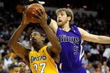 LAS VEGAS - OCTOBER 15:  Ron Artest #37 of the Los Angeles Lakers drives against Andres Nocioni #5 of the Sacramento Kings during their preseason game at the Thomas & Mack Center October 15, 2009 in Las Vegas, Nevada. NOTE TO USER: User expressly acknowledges and agrees that, by downloading and/or using this Photograph, user is consenting to the terms and conditions of the Getty Images License Agreement.  (Photo by Ethan Miller/Getty Images)