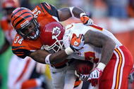 CINCINNATI - DECEMBER 28: Kyries Hebert #34 of the Cincinnati Bengals tackles Larry Johnson #27 of the Kansas City Chiefs near the endzone late in the fourth quarter during the NFL on December 28, 2008 at Paul Brown Stadium in Cincinnati, Ohio. (Photo by Andy Lyons/Getty Images)