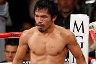 LAS VEGAS - NOVEMBER 14:  Manny Pacquiao stands in a neutral corner after knocking Miguel Cotto down in the third round during their WBO welterweight title fight at the MGM Grand Garden Arena on November 14, 2009 in Las Vegas, Nevada. Pacquiao defeated Cotto by TKO in the 12th round.  (Photo by Ethan Miller/Getty Images)