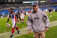 CHARLOTTE, NC - OCTOBER 25:  Coach Dick Jauron and Ashlee Palmer of the Buffalo Bills leave the field after a game against the Carolina Panthers at Bank of America Stadium on October 25, 2009 in Charlotte, North Carolina. Buffalo won 20-9. (Photo by Grant Halverson/Getty Images)
