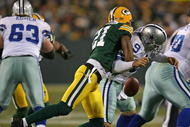 GREEN BAY, WI - NOVEMBER 15: Charles Woodson #21 of the Green Bay Packers hits Tony Romo #9 of the Dallas Cowboys forcing a fumble at Lambeau Field on November 15, 2009 in Green Bay, Wisconsin. The Packers defeated the Cowboys 17-7. (Photo by Jonathan Daniel/Getty Images)