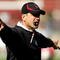 PALO ALTO, CA - NOVEMBER 07:  Stanford Cardinal head coach Jim Harbaugh instructs his team during warmups before their game against the Oregon Ducks at Stanford Stadium on November 7, 2009 in Palo Alto, California.  (Photo by Ezra Shaw/Getty Images)