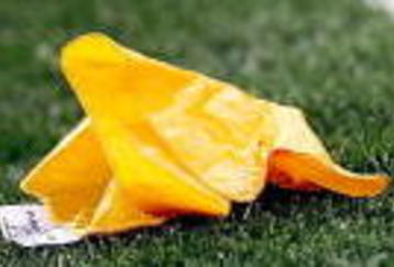 ARLINGTON, TX - SEPTEMBER 05:  A yellow penalty flag during a game between the Brigham Young Cougars and the Oklahoma Sooners at Cowboys Stadium on September 5, 2009 in Arlington, Texas.  (Photo by Ronald Martinez/Getty Images)