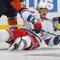 UNIONDALE, NY - OCTOBER 28: Sean Avery #16 of the New York Rangers is taken down by Tim Jackman #28 of the New York Islanders at the Nassau Coliseum on October 28, 2009 in Uniondale, New York. The Islanders defeated the Rangers 3-1. (Photo by Bruce Bennett/Getty Images)