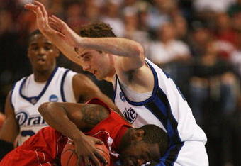TAMPA, FL - MARCH 21:  Adam Emmenecker #15 of the Drake Bulldogs guards Tyrone Brazelton #3 of the Western Kentucky Hilltoppers during the first round of the 2008 NCAA Tournament West Regional at the St. Pete Times Forum on March 21, 2008 in Tampa, Florida.  (Photo by Doug Benc/Getty Images)