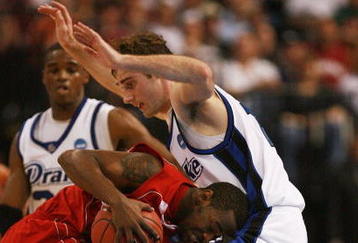 TAMPA, FL - MARCH 21:  Adam Emmenecker #15 of the Drake Bulldogs guards Tyrone Brazelton #3 of the Western Kentucky Hilltoppers during the first round of the 2008 NCAA Tournament West Regional at the St. Pete Times Forum on March 21, 2008 in Tampa, Florida.  (Photo by Doug Benc/Getty Images)