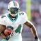FOXBORO, MA - NOVEMBER 08:  Ricky Williams #34 of the Miami Dolphins carries the ball in the second quarter agianst the New England Patriots on November 8, 2009 at Gillette Stadium in Foxboro, Massachusetts.  (Photo by Elsa/Getty Images)