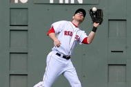 BOSTON - OCTOBER 11:  Jason Bay #44 of the Boston Red Sox catches a Torii Hunter #48 of the Los Angeles Angels of Anaheim fly ball in the third inning of Game Three of the ALDS during the 2009 MLB Playoffs at Fenway Park on October 11, 2009 in Boston,  Massachusetts. (Photo by Jim Rogash/Getty Images)