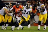 DENVER - NOVEMBER 09:  Rashard Mendenhall #34 of the Pittsburgh Steelers rushes 34 yards for a first down against the Denver Broncos in the fourth quarter during NFL action at Invesco Field at Mile High on November 9, 2009 in Denver, Colorado. The Steelers defeated the Broncos 28-10.  (Photo by Doug Pensinger/Getty Images)