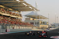 ABU DHABI, UNITED ARAB EMIRATES - NOVEMBER 01:  Lewis Hamilton (R) of Great Britain and McLaren Mercedes leads from Sebastian Vettel (L) of Germany and Red Bull Racing as they drive during the Abu Dhabi Formula One Grand Prix at the Yas Marina Circuit on November 1, 2009 in Abu Dhabi, United Arab Emirates.  (Photo by Ker Robertson/Getty Images)