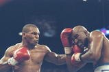 28 Jun 1997: Mike Tyson (L) lands a blow to the chin of Evander Holyfield during their bout against Mike Tyson at the MGM Grand Garden in Las Vegas, Nevada. Holyfield won the fight when referee Mills Lane disqualified Tyson in the third round after biting Holyfield twice.