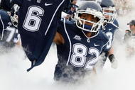 EAST HARTFORD, CT - OCTOBER 31:  Kashif Moore #82 of the Connecticut Huskies carries out the jersey of murdered teammate Jasper Howard #6 before the game against the Rutgers Scarlet Knights on October 31, 2009 at Rentschler Field in East Hartford, Connecticut.  (Photo by Elsa/Getty Images)