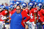 LAWRENCE, KS - SEPTEMBER 26:  Head coach Mark Mangino of the Kansas Jayhawks watches during warm-ups just prior to the start of the game against the Southern Mississippi Golden Eagles on September 26, 2009 at Memorial Stadium in Lawrence, Kansas.  (Photo by Jamie Squire/Getty Images)