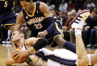 EAST RUTHERFORD, NJ - NOVEMBER 17:  Brook Lopez #11 of the New Jersey Nets fights for the ball with Danny Granger #33 of The Indiana Pacers during their game on November 17, 2009 at The Izod Center in East Rutherford, New Jersey.  NOTE TO USER: User expressly acknowledges and agrees that, by downloading and/or using this Photograph, user is consenting to the terms and conditions of the Getty Images License Agreement.  (Photo by Al Bello/Getty Images)