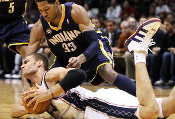 EAST RUTHERFORD, NJ - NOVEMBER 17:  Brook Lopez #11 of the New Jersey Nets fights for the ball with Danny Granger #33 of The Indiana Pacers during their game on November 17, 2009 at The Izod Center in East Rutherford, New Jersey.  NOTE TO USER: User expressly acknowledges and agrees that, by downloading and/or using this Photograph, user is consenting to the terms and conditions of the Getty Images License Agreement.  (Photo by Al Bello/Getty Images)