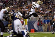 ST. LOUIS - NOVEMBER 15: Reggie Bush #25 of the New Orleans Saints scores a touchdown against the St. Louis Rams at the Edward Jones Dome on November 15, 2009 in St. Louis, Missouri.  (Photo by Dilip Vishwanat/Getty Images)