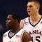 MINNEAPOLIS - MARCH 20: (L-R) Sherron Collins #4 and Cole Aldrich #45 of the Kansas Jayhawks look on against the North Dakota State Bison during the first round of the NCAA Division I Men's Basketball Tournament at the Hubert H. Humphrey Metrodome on March 20, 2009 in Minneapolis, Minnesota. Kansas won 84-74. (Photo by Jonathan Daniel/Getty Images)