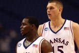 MINNEAPOLIS - MARCH 20:  (L-R) Sherron Collins #4 and Cole Aldrich #45 of the Kansas Jayhawks look on against the North Dakota State Bison during the first round of the NCAA Division I Men's Basketball Tournament at the Hubert H. Humphrey Metrodome on March 20, 2009 in Minneapolis, Minnesota. Kansas won 84-74. (Photo by Jonathan Daniel/Getty Images)