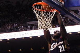 ORLANDO, FL - NOVEMBER 11: J.J. Hickson #21 of the Cleveland Cavaliers dunks as Matt Barnes #22 of the Orlando Magic looks on during the game on November 11, 2009 at Amway Arena in Orlando, Florida. NOTE TO USER: User expressly acknowledges and agrees that, by downloading and/or using this Photograph, user is consenting to the terms and conditions of the Getty Images License Agreement. (Photo by Sam Greenwood/Getty Images)