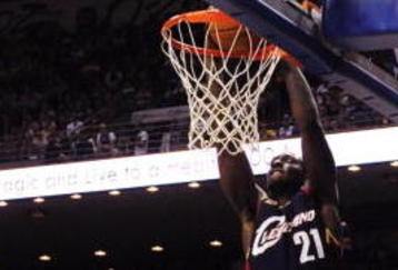 ORLANDO, FL - NOVEMBER 11:  J.J. Hickson #21 of the Cleveland Cavaliers dunks as Matt Barnes #22 of the Orlando Magic looks on during the game on November 11, 2009 at Amway Arena in Orlando, Florida. NOTE TO USER: User expressly acknowledges and agrees that, by downloading and/or using this Photograph, user is consenting to the terms and conditions of the Getty Images License Agreement. (Photo by Sam Greenwood/Getty Images)