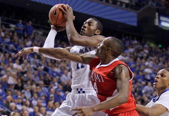 LEXINGTON, KY - NOVEMBER 16: John Wall #11 of the Kentucky Wildcats shoots the ball while defended by Kenny Hayes #14 of the Miami University Redhawks during the game at Rupp Arena on November 16, 2009 in Lexington, Kentucky.  (Photo by Andy Lyons/Getty Images)