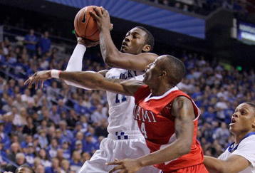 LEXINGTON, KY - NOVEMBER 16: John Wall #11 of the Kentucky Wildcats shoots the ball while defended by Kenny Hayes #14 of the Miami University Redhawks during the game at Rupp Arena on November 16, 2009 in Lexington, Kentucky.  (Photo by Andy Lyons/Getty Images)