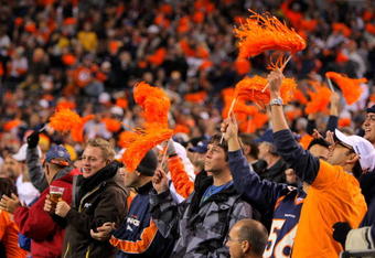 DENVER - NOVEMBER 09:  Fans support the Denver Broncos against the Pittsburgh Steelers defense on during NFL action at Invesco Field at Mile High on November 9, 2009 in Denver, Colorado. The Steelers defeated the Broncos 28-10.  (Photo by Doug Pensinger/Getty Images)