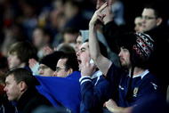 CARDIFF, WALES - NOVEMBER 14:  Scottish fans show feelings towards their team's performance during the International Friendly match between Wales and Scotland at the Cardiff City Stadium on November 14, 2009 in Cardiff, Wales.  (Photo by Richard Heathcote/Getty Images)
