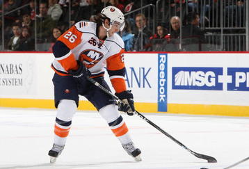 NEWARK, NJ - NOVEMBER 06:  Matt Moulson #26 of the New York Islanders skates against the New Jersey Devils during their NHL game at the Prudential Center on November 6, 2009 in Newark, New Jersey.  (Photo by Jim McIsaac/Getty Images)