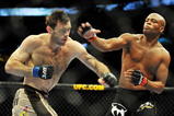 PHILADELPHIA - AUGUST 08:  Anderson Silva (R) throws a right punch to Forrest Griffin during their light heavyweight bout at UFC 101: Declaration at the Wachovia Center on August 8, 2009 in Philadelphia, Pennsylvania.  (Photo by Jon Kopaloff/Getty Images)