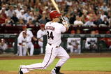 PHOENIX - APRIL 10:  Conor Jackson #34 of the Arizona Diamondbacks hits a two-run single against the Los Angeles Dodgers during the third inning of the game at Chase Field on April 10, 2009 in Phoenix, Arizona.  (Photo by Christian Petersen/Getty Images)