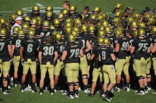 BOULDER, CO - NOVEMBER 07: The Colorado Buffaloes huddle on the field as the prepare to face the Texas A&M Aggies during NCAA college football action at Folsom Field on November 7, 2009 in Boulder, Colorado. Colorado defeated Texas A&M 35-34.  (Photo by Doug Pensinger/Getty Images)