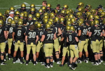 BOULDER, CO - NOVEMBER 07: The Colorado Buffaloes huddle on the field as the prepare to face the Texas A&M Aggies during NCAA college football action at Folsom Field on November 7, 2009 in Boulder, Colorado. Colorado defeated Texas A&M 35-34.  (Photo by Doug Pensinger/Getty Images)